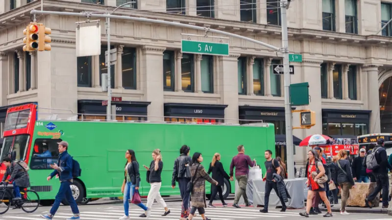 City intersection with crosswalk representing SUV crashes into NYC storefront and urban safety