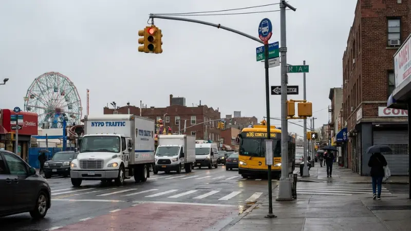 Brooklyn streetscape with bus stop and commercial vehicles symbolizing the B36 Bus Crash in Coney Island.