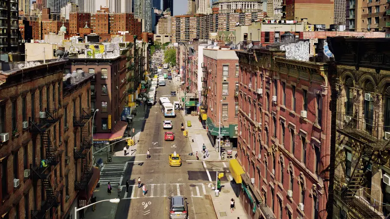 New York City bus driving through traffic representing urban transit environments linked to bus accident injuries.