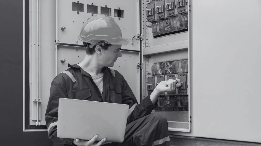 Home service professional working on equipment