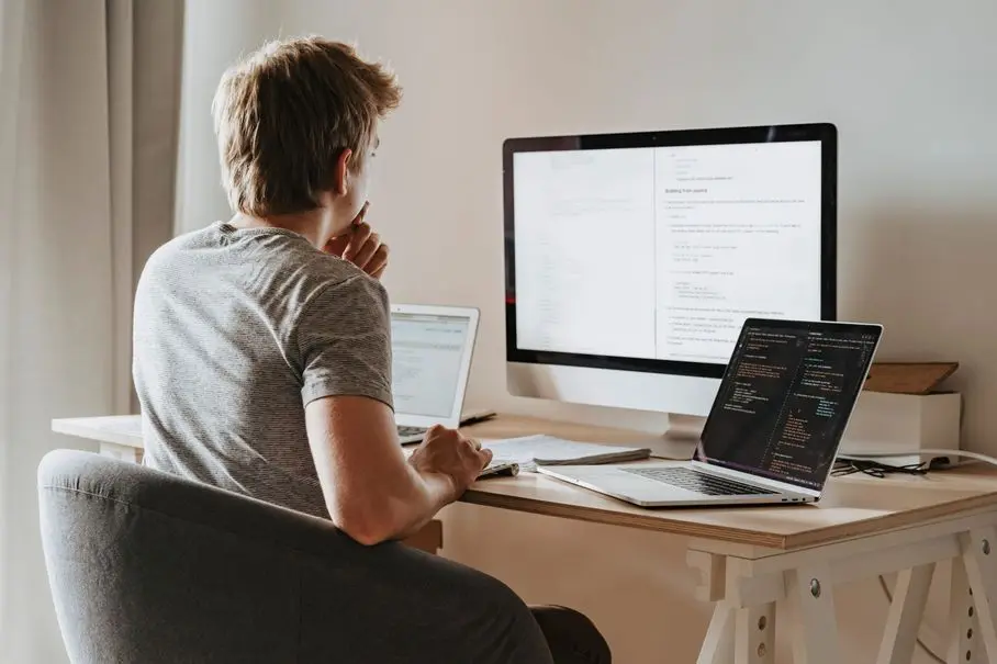 Business owner reviewing website strategy on a laptop