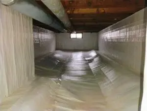 Professional crawl space encapsulation with a sealed vapor barrier covering the floor and foundation walls to help control moisture.