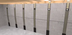 Basement with gray concrete block walls, reinforced by vertical carbon fiber straps evenly spaced. The floor is concrete, and the ceiling is wooden beams.