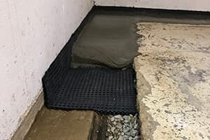 Diagram of French drains illustrating installation and maintenance for effective basement waterproofing solutions.