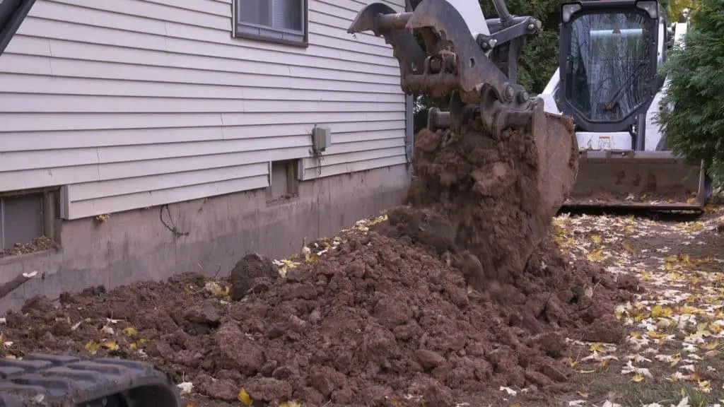 Image of a Basement Repair Specialists LLC technician repairing a home's foundation with advanced equipment.
