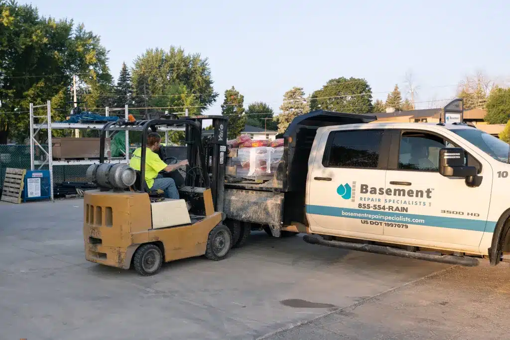 Basement Repair Specialists LLC performing wall straightening and drain tile installation services.