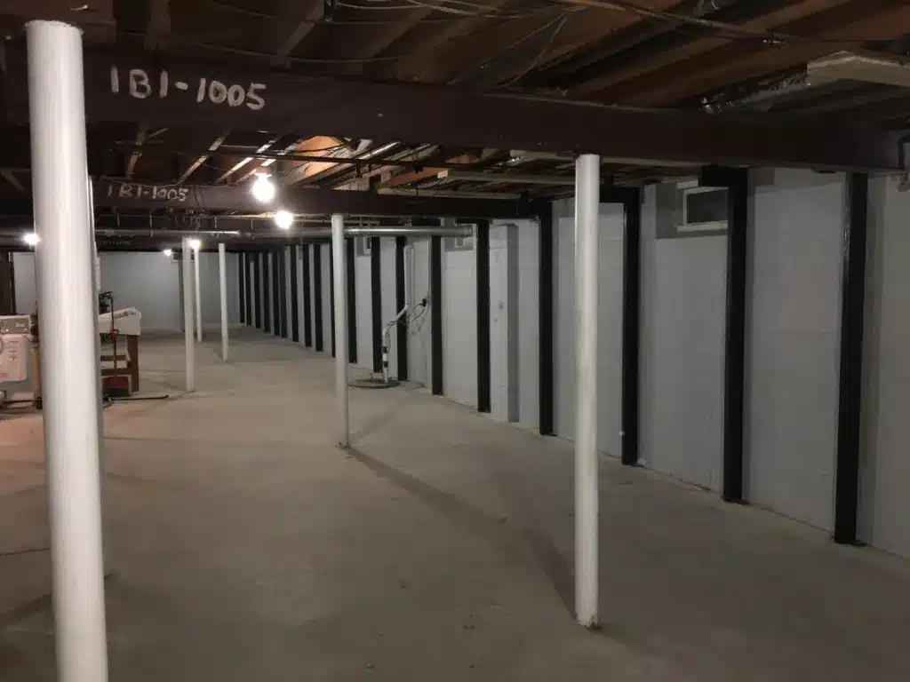 Basement repair by Basement Repair Specialists LLC, featuring excavation and wall straightening services.