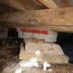 Failing crawl space beam support illustrating how to fix sagging floors over a crawl space using professional structural repair methods.