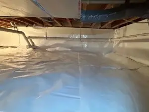 Completed crawl space encapsulation with Crawl Seal vapor barrier and spray foam insulation in Zionsville IN
