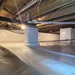 Encapsulated crawl space in Indianapolis, IN featuring a sealed vapor barrier, reinforced support piers, and moisture control system installed by Indiana Crawl Space Repair.
