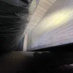 Encapsulated crawl space in Nineveh, IN showing treated wooden joists after mold remediation and moisture control work.