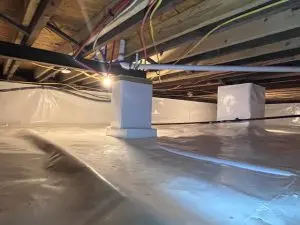 Encapsulated crawl space in Indianapolis, IN featuring a sealed vapor barrier, reinforced support piers, and moisture control system installed by Indiana Crawl Space Repair.