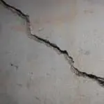 Cracked foundation wall illustrating the need for professional foundation repair and carbon fiber reinforcement solutions.