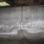 Cracked basement wall showing structural damage, illustrating the need for carbon fiber repair solutions by StablWall.