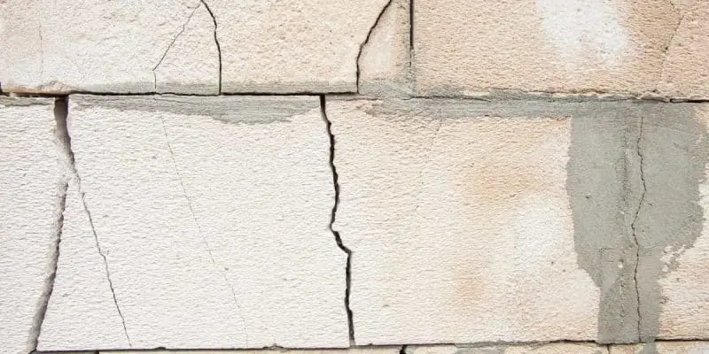 Cracked wall surface illustrating common causes of wall cracks, relevant to wall repair discussions.