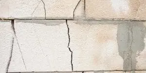 Horizontal crack along mortar joint in concrete block foundation wall