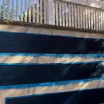 Carbon fiber repair strips installed on a foundation wall, showcasing durability and strength for structural integrity.