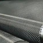 Close-up of carbon fiber reinforcement material, showcasing its lightweight and durable texture, relevant to construction applications highlighted by StablWall.