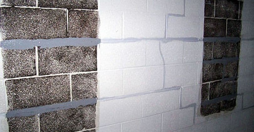 Foundation wall with visible crack repairs and sealant application, illustrating foundation stabilization techniques relevant to professional repair services.