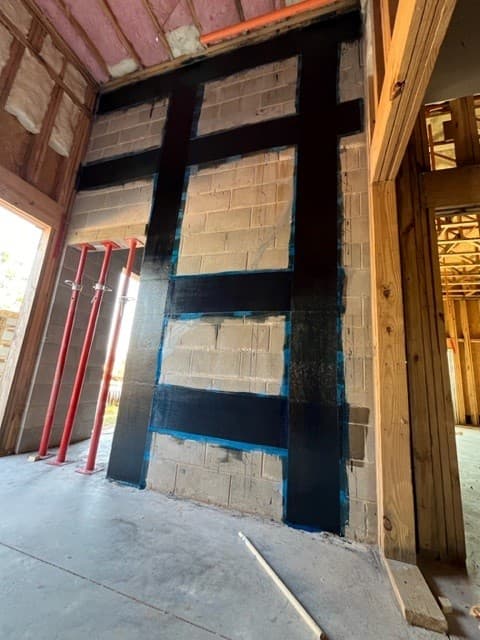 StablWall carbon fiber installed on a masonry wall during construction