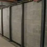 Bowed basement walls reinforced with steel braces, illustrating professional repair solutions for foundation issues.