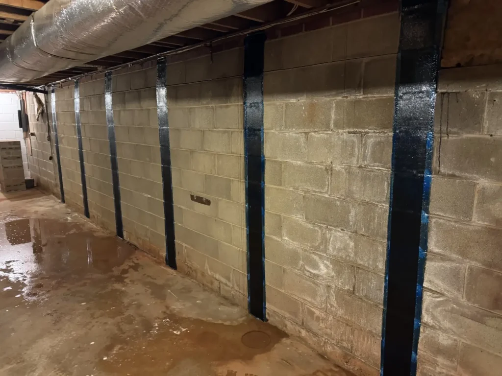 StablWall carbon fiber straps reinforcing a basement foundation wall