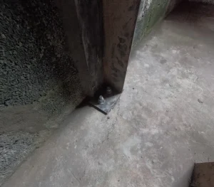 Steel soldier beam anchored to basement floor stabilizing bowing foundation wall in Salem, VA
