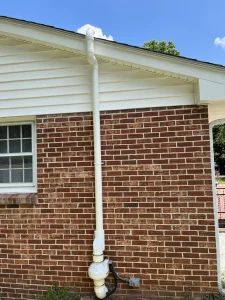 Radon mitigation system exterior vent pipe installed on a home in Radford, VA to safely reduce elevated indoor radon levels.