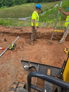 Sure-Dri crew installing helical piers for foundation stabilization in Rocky Mount, VA