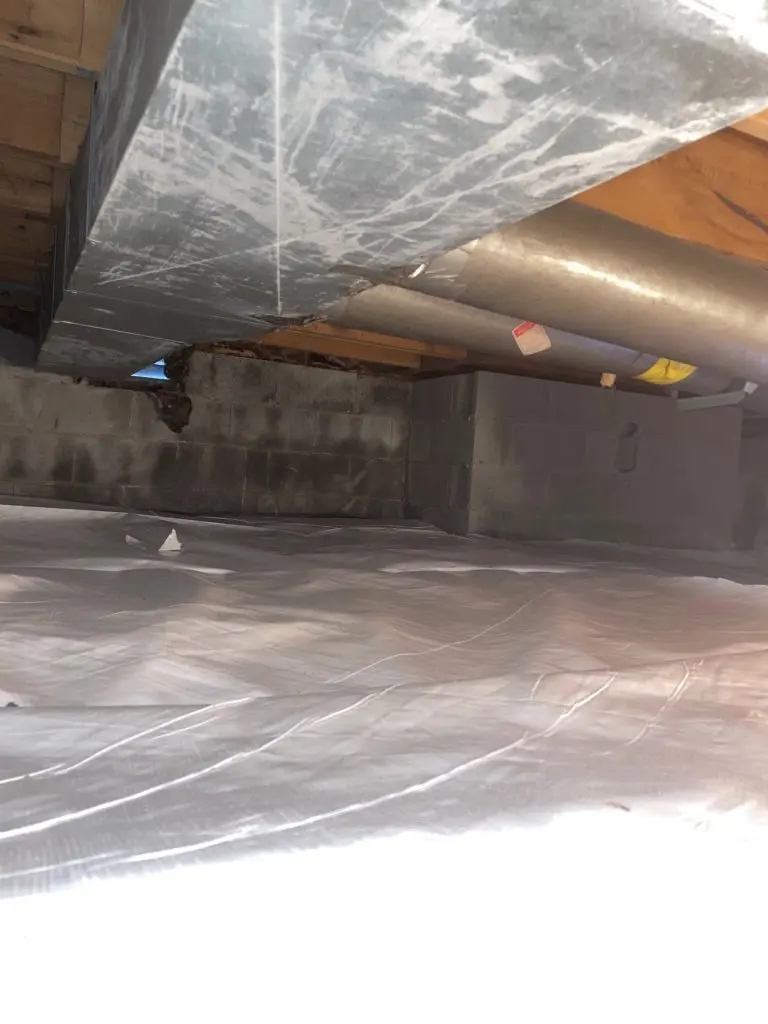 Completed crawl space encapsulation system in Waterville, OH with moisture barrier and waterproofing protection.