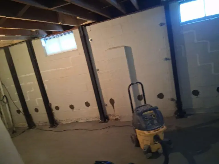 Basement foundation repair in Maumee OH with steel beam wall reinforcements and crack repair