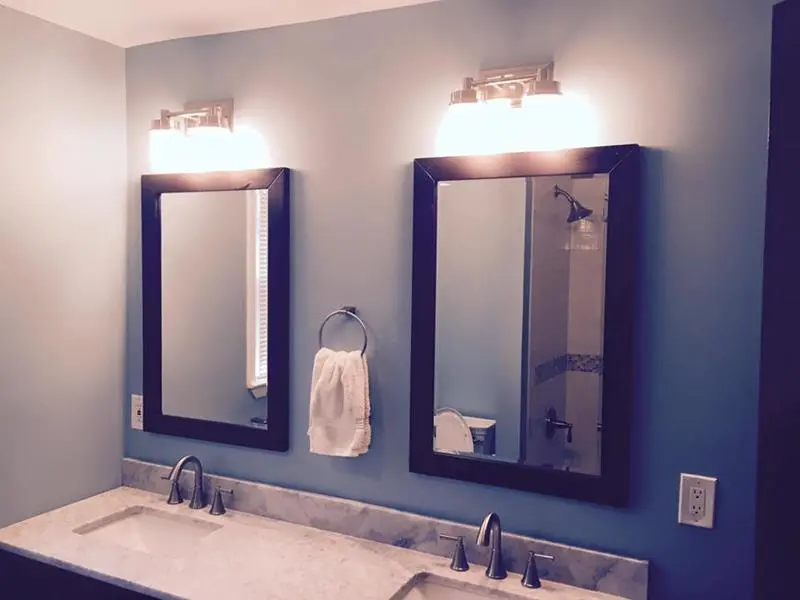 Modern double vanity showcasing the Luxury Bathroom Remodeling Checklist with elegant mirrors, premium lighting, and marble countertop in a New Jersey home.