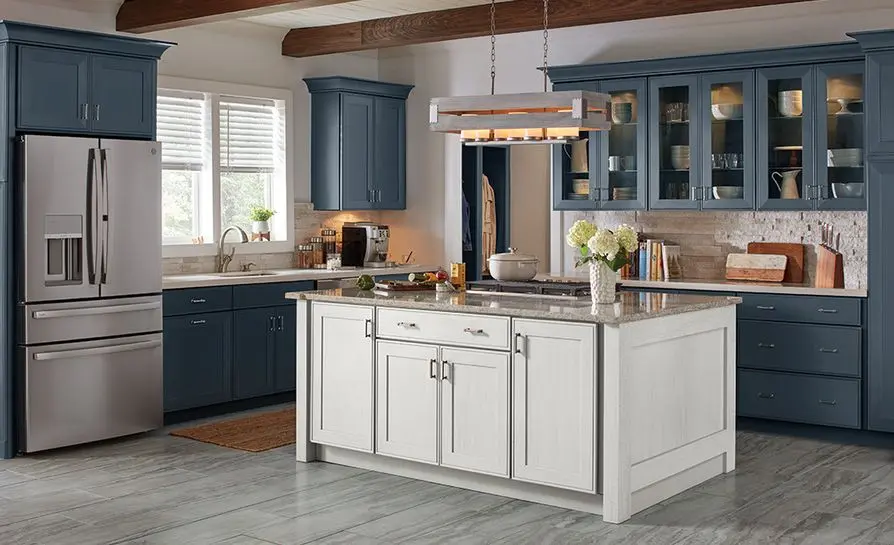 Modern blue and white kitchen remodel with island, quartz countertops, and stainless steel appliances