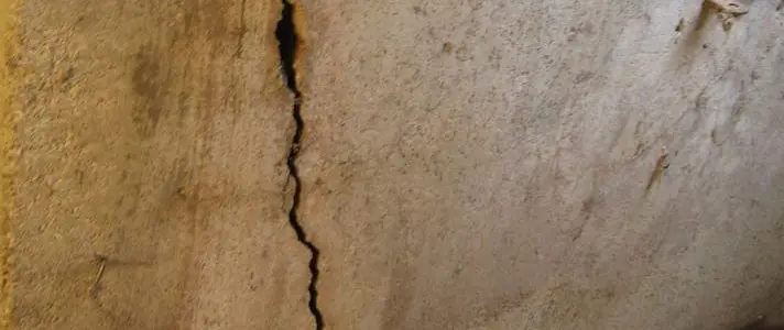 Large foundation wall crack showing signs you may need waterproofing services