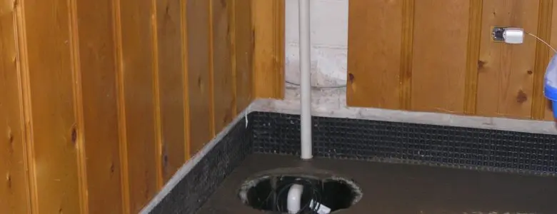 Sump pump pit installation in a basement floor to prevent water accumulation and flooding
