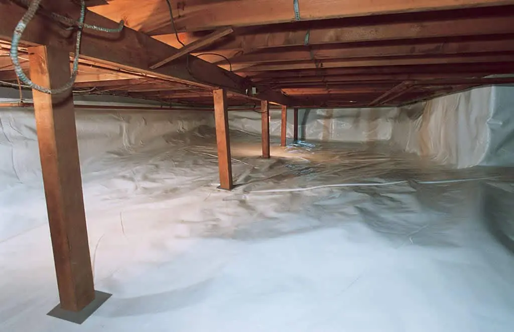 Encapsulated crawl space with moisture barrier installed for waterproofing protection