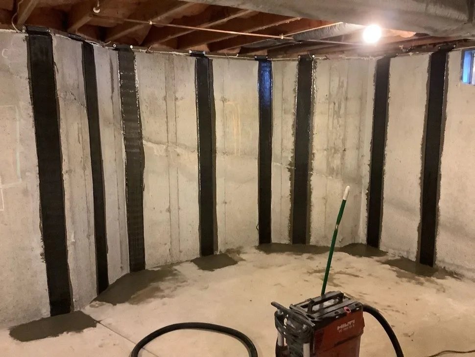 Carbon fiber wall reinforcement installed to stabilize cracked basement foundation walls in Connecticut