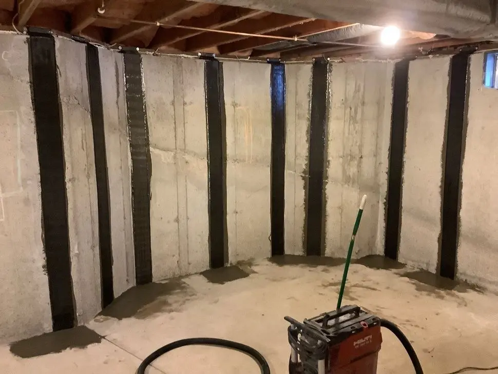 Carbon fiber wall reinforcement installed to stabilize cracked basement foundation walls in Connecticut