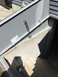 New powder-coated gray Bilco hatchway door installed in Milford CT basement entrance
