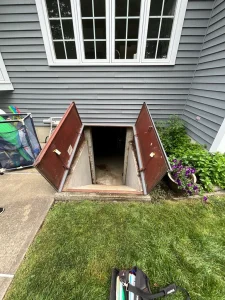 Old rusty basement hatchway doors open in Milford CT before Bilco door replacement
