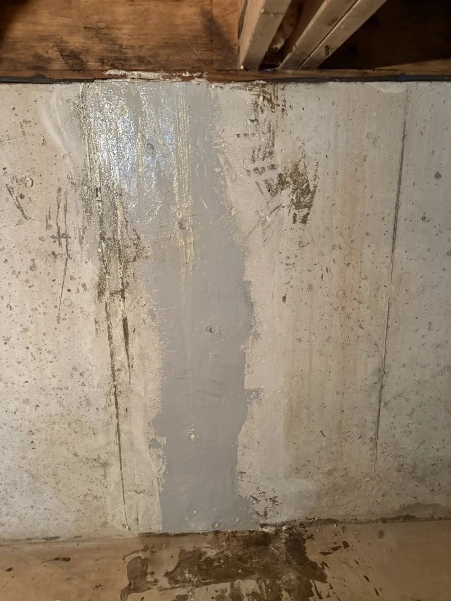 Carbon fiber foundation crack repair completed on a basement wall in Colchester, CT, sealing a vertical crack to prevent water intrusion and reinforce the foundation.