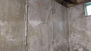 Cracked basement wall showing signs that foundation repair may be needed in a Michigan home