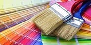 Paintbrushes on color swatches, illustrating options for low and no VOC paints related to indoor air quality.