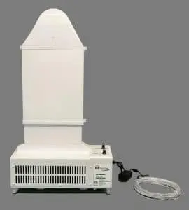 A white, rectangular laboratory instrument with a vented base and a tall, tapered top against a gray background. A cord is coiled beside it.