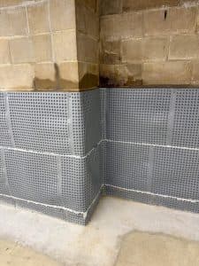 interior perimeter drain, dimpled drainage wall membrane