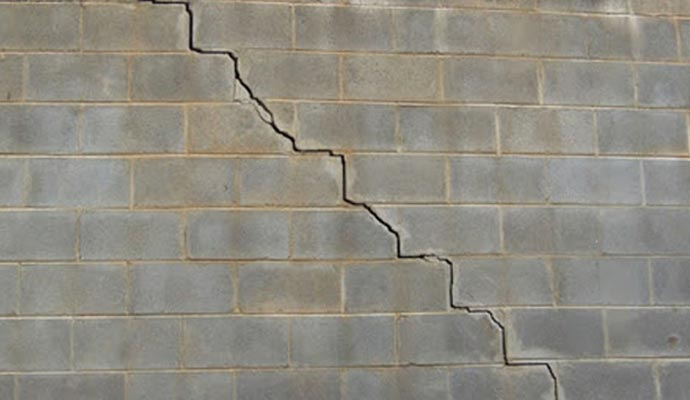 Cracked foundation wall highlighting structural damage, relevant to foundation repair and home safety in New Jersey.