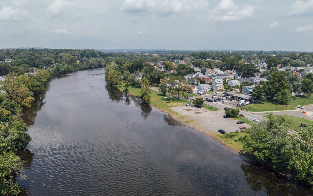 Aerial view of Elmwood Park, NJ, riverfront and residential area, basement waterproofing solutions.