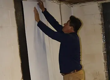 Crawl space vapor barrier installation