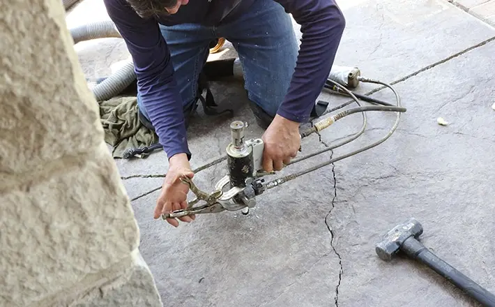 Concrete leveling using mudjacking