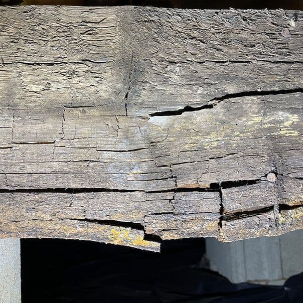 Wood rot and damage indicating foundation issues and potential water damage.